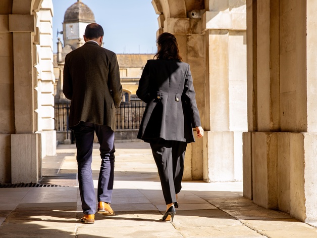 University staff members walkinG