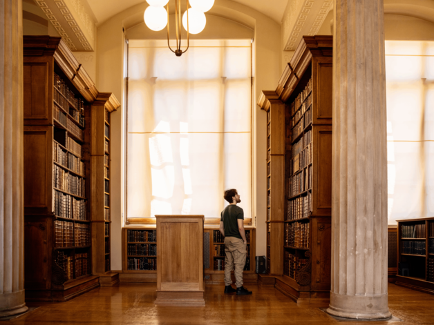 Person standing in a library